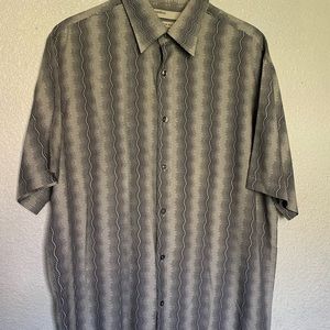 It’s large size,gray black and white color,half sleeve shirt.